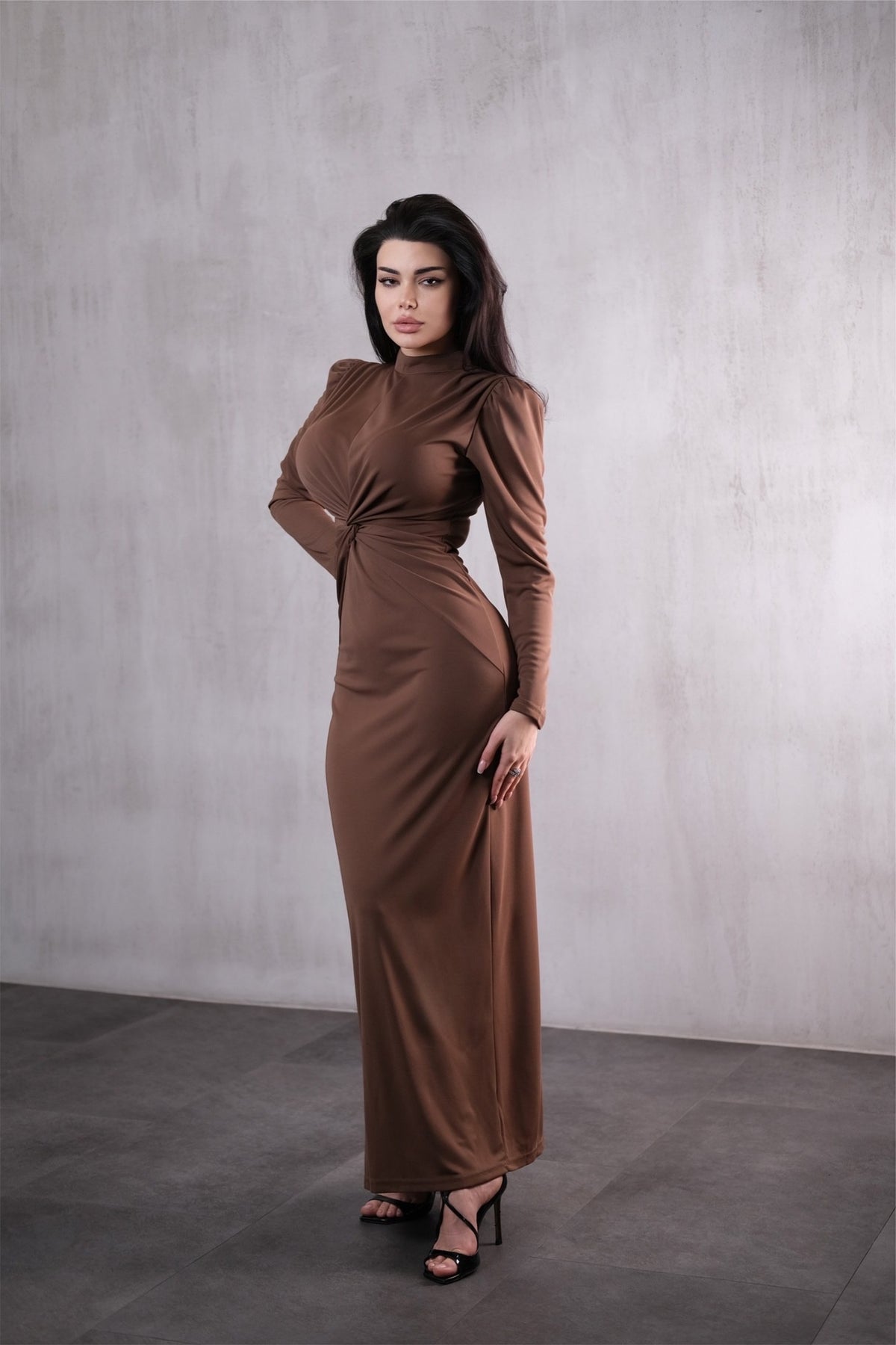Elegant long brown dress with a twist detail