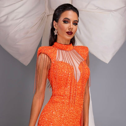 Orange gown with sequins and fringe details